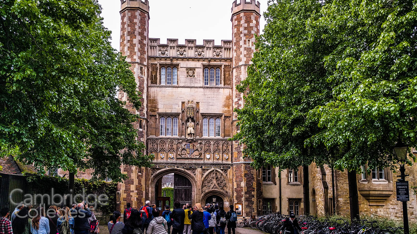 Crowds admire the Great Gate of Trinity college, Cambridge