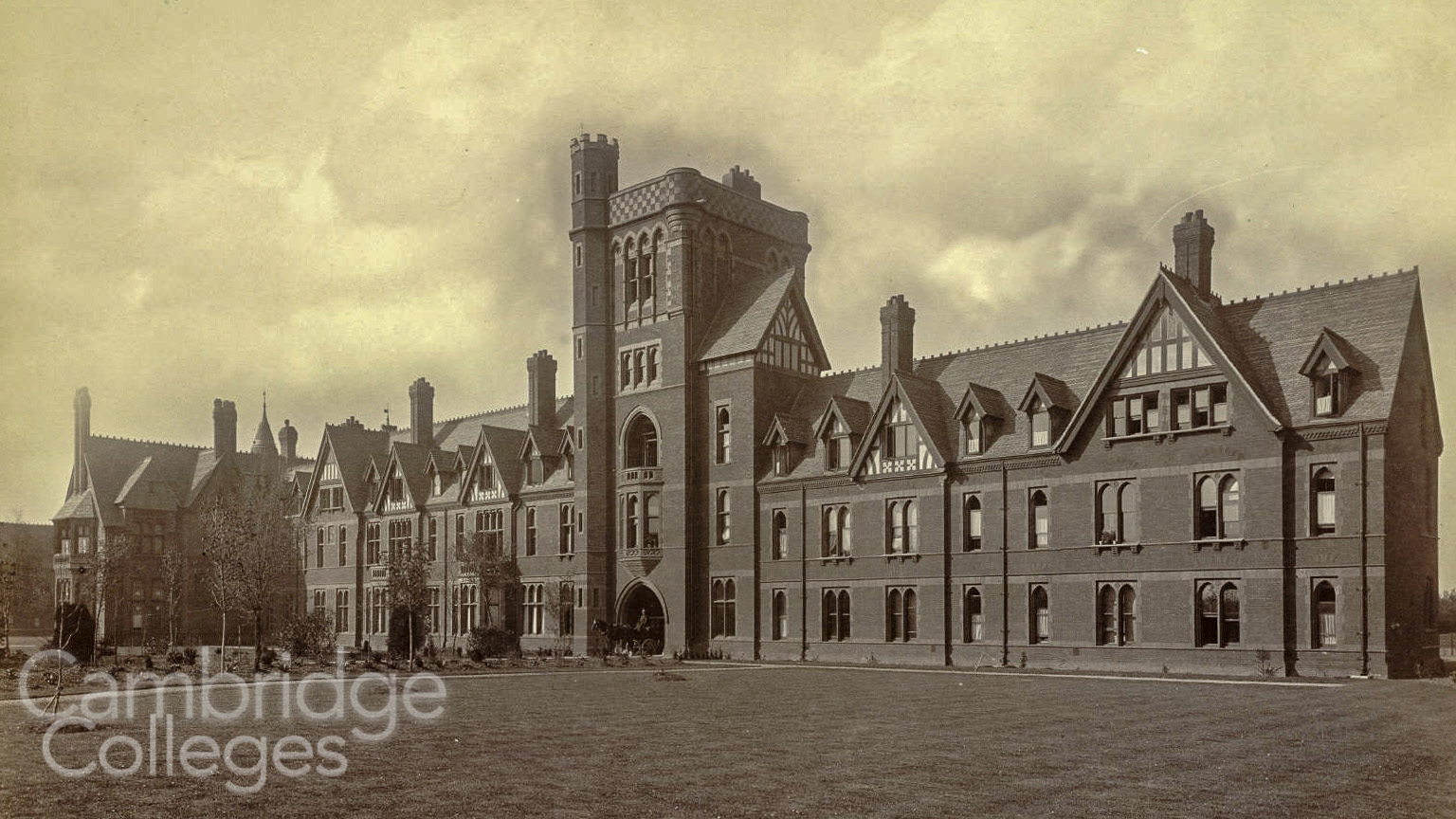 The main entrance to Girton College, with it's parapetted tower, monochrome