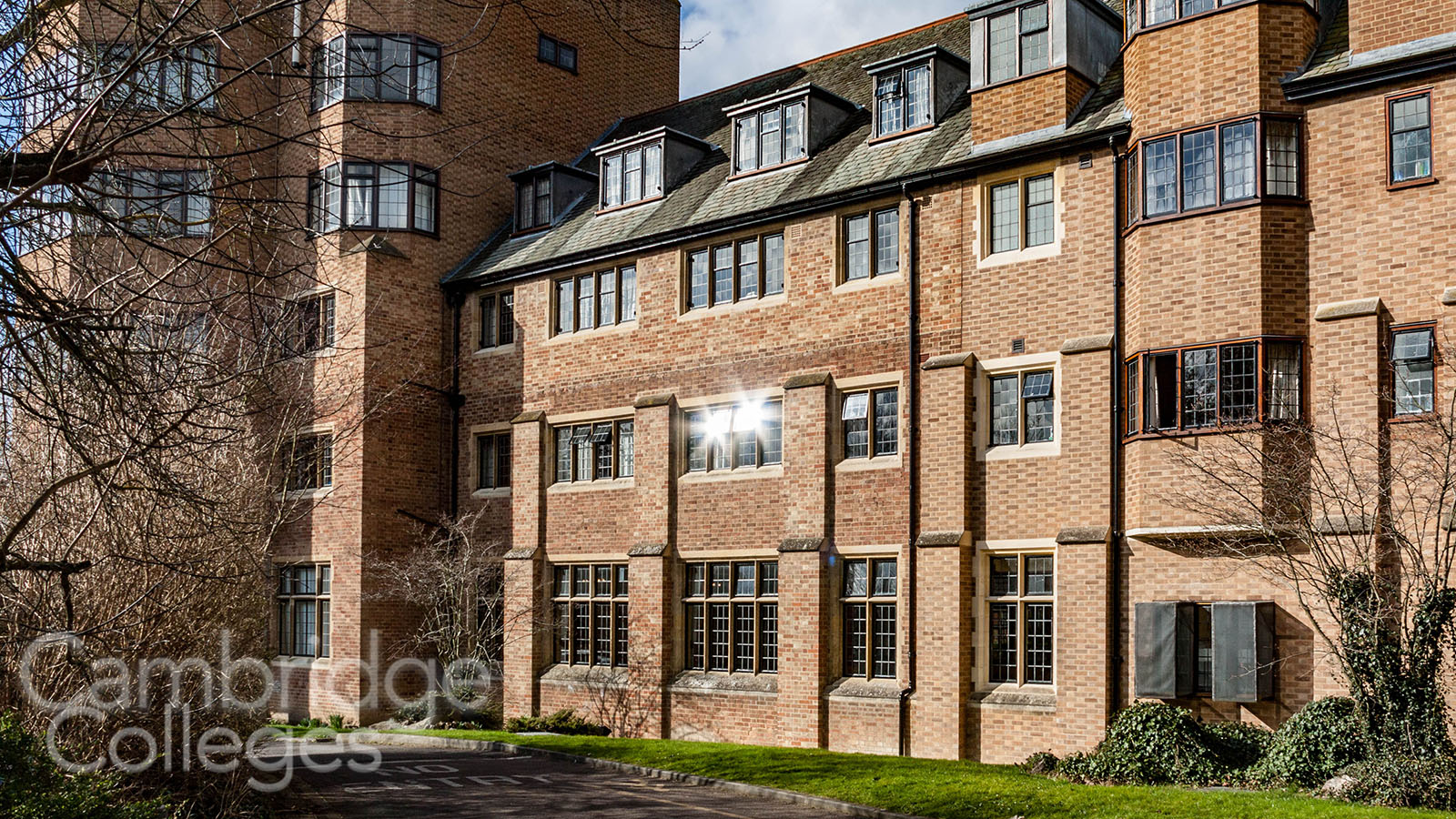 Sunlight glints off the windows of the Norfkolk building at St Edmund's college